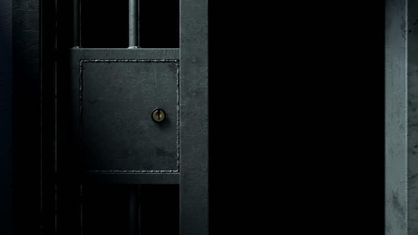 A static camera closeup of a heavy welded iron jail cell door sliding and slamming shut on a dark moody background | Shutterstock HD Video #34281451