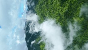 Moving Clouds with Evergreen Forest and Beautiful Mountain Range Landscape with Clear Blue Sky, National Park Northern Thailand, Aerial Drone, True Vertical 4k Video for Social Media 9:16 Portrait