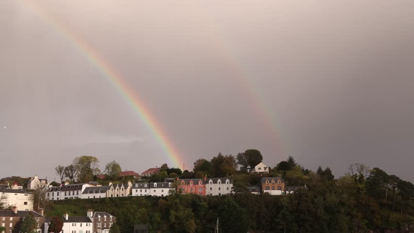 double rainbow in rain storm above portree on Isle of Skye, hIghlands of Scotland