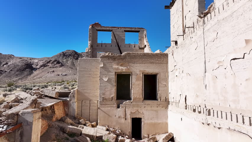 Aerial Cook bank Rhyolite Ghost Town Nevada inside climb 1. Near Death Valley National Park in California and Beatty Nevada. 1905 gold rush. 1911 ghost town. Ruins, banks, school, train station.