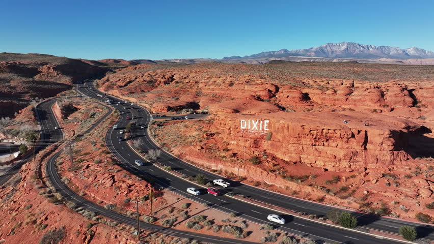 Aerial Dixie highway Pioneer Park St George Utah red rock 1. Southwestern desert Utah. Geological landscape wind, weather and water erosion red rock mountain valley. Hiking  nature travel. Climbing. Royalty-Free Stock Footage #3428227851