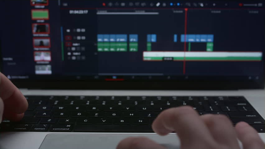 Monitor or display of the editor's laptop. Uses a computer to creatively create a video clip. Makes color correction of video content. A freelance colorist works at home in the studio. Cinematographer