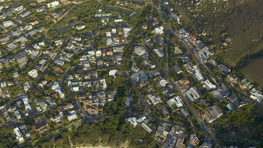 Property, community or drone of neighborhood or coast for suburban street or residential. Houses, background or aerial view of beach location or real estate in Llandudno in Cape Town, South Africa