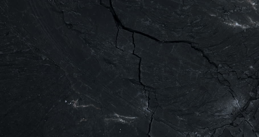 Cracks in the ground in Iceland volcano eruption site, aerial view at night	
