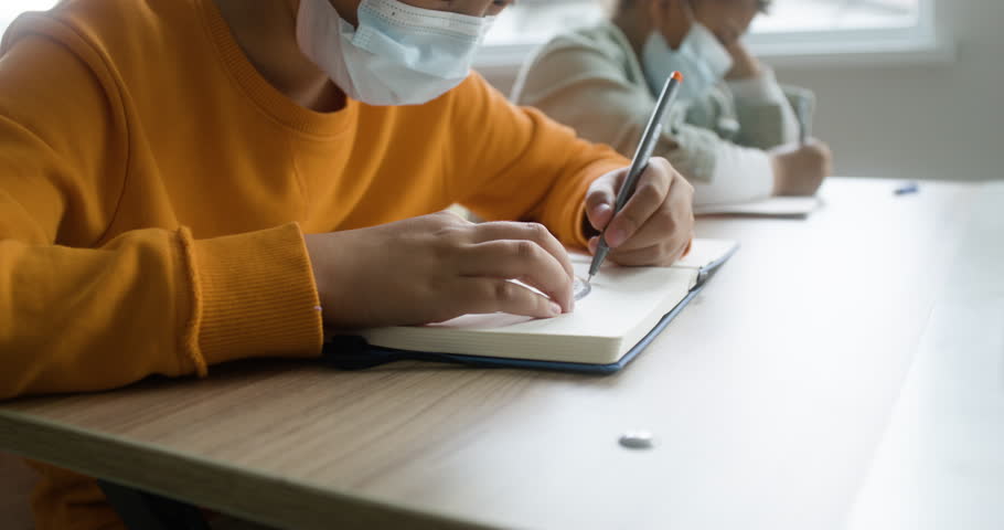Students wearing masks in the classroom Royalty-Free Stock Footage #3428412367