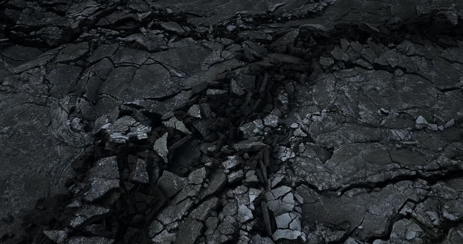 Dramatic cracks in the ground in Icelands volcano eruption site, aerial view at night	
