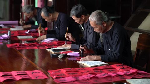 Vung Tau, Vietnam - March, 2017: Writing couplets for Spring Festival at Long Son, Vung Tau city. Calligraphy giving is a tradition popular for Spring holiday to Vietnamese people