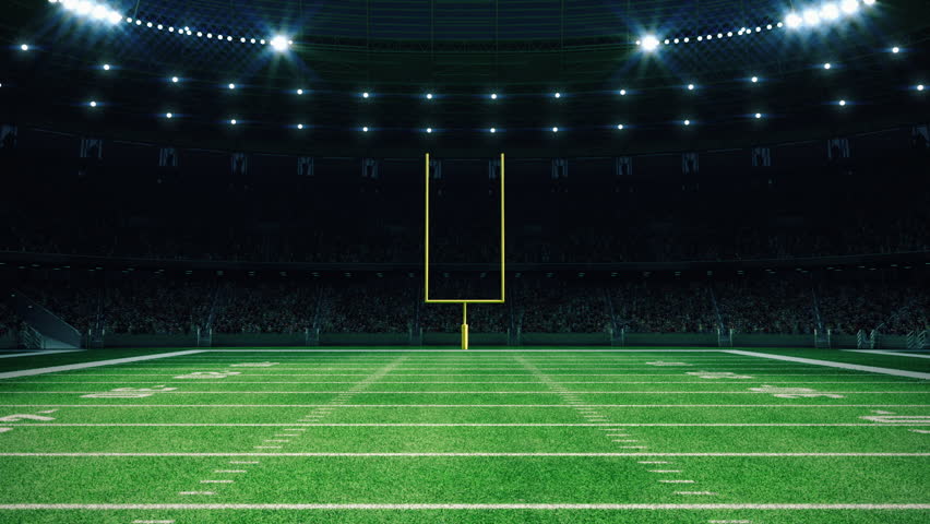 American football night stadium with fans iilluminated by spotlights waiting game