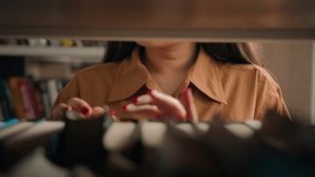 Close-up unrecognizable woman teacher girl student female customer bookworm browsing bookcase searching necessary book to read on bookshelf looking for literature in library search textbook books - Powered by Shutterstock - Get 15% off with code: PIKWIZARD15