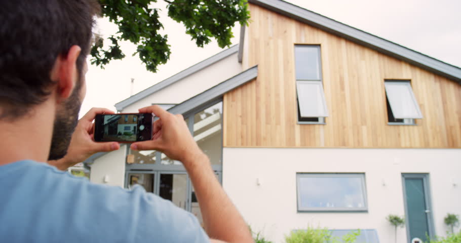 Outdoor, phone and photography of house, sale for review and pictures with mobile app. Person, choice and real estate with ecommerce technology for online shopping, internet and property website