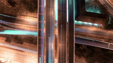 aerial shot view of traffic on freeway interchange at night. 4K UHD timelapse background