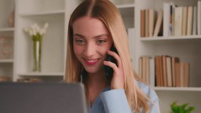 Happy smiling girl Caucasian woman indoors library home office female business lady student businesswoman employer entrepreneur talking phone answer call consult clients typing laptop work computer - Powered by Shutterstock - Get 15% off with code: PIKWIZARD15