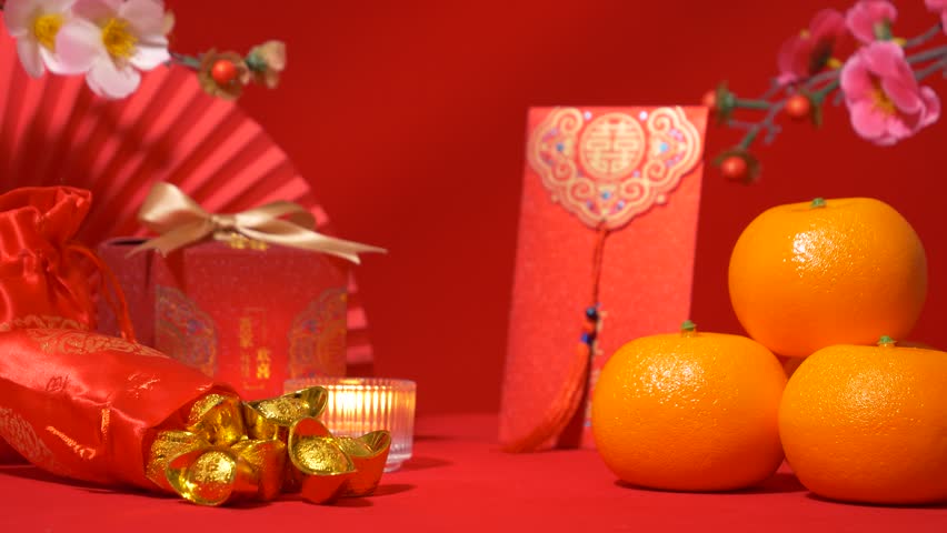 looping of Chinese Lunar New Year red background. ancient Chinese gold bar in silk bag, red envelope, ang pow, red packet, red gift box with text best wishes, oranges, paper fan, plum blossom, candle