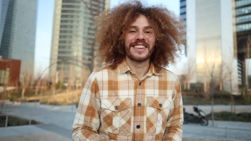 Portrait of a young Caucasian redhead man looking at the camera smiling and pointing while nodding - Powered by Shutterstock - Get 15% off with code: PIKWIZARD15