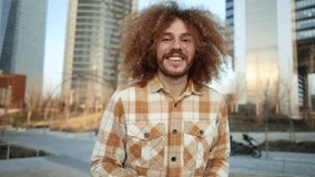 Portrait of a young Caucasian redhead man looking at the camera smiling and pointing while nodding - Powered by Shutterstock - Get 15% off with code: PIKWIZARD15
