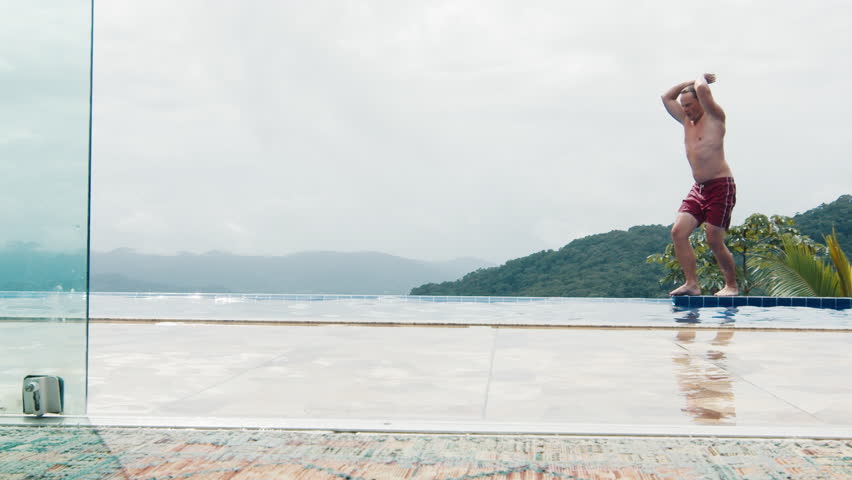 Man jumps into the private swimming pool
