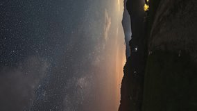 Vertical panorama of Starry night sky with Milky Way Galaxy stars over countryside landscape Astronomy Time lapse