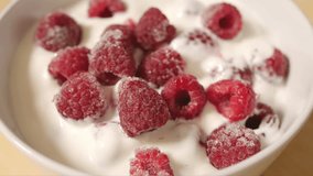 Close-up on Frozen raspberries with yogurt. - Powered by Shutterstock - Get 15% off with code: PIKWIZARD15