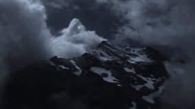 Aerial view of snowy mountains at night, moonlight, scenic clouds - Powered by Shutterstock - Get 15% off with code: PIKWIZARD15