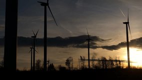 a modern wind park spinning in the morning light 4k video
