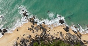 top view of beautiful seascape natural beach stone and wave in Hainan Wanning China