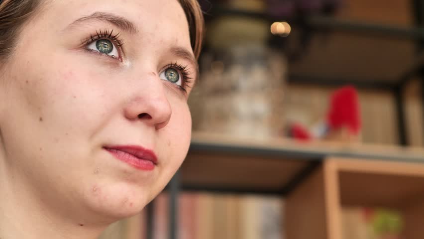 Close up of Smiling positive woman enjoy cake. Food calories. Close up hungry overeating young girl eating cake with big appetite. Portrait of girl with sweet cake. Woman tasting sweet cookies. Space