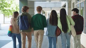 back view of a multi-ethnic group of students in language exchange program walking together outside college - Powered by Shutterstock - Get 15% off with code: PIKWIZARD15