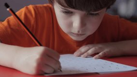 School Boy Practicing Writing Numbers at Home. Child Working on His Homework. Little Boy Studying Learning at Home. Child, Learning Doing Math for Education, Making Homework Numbers in His Room. - Powered by Shutterstock - Get 15% off with code: PIKWIZARD15