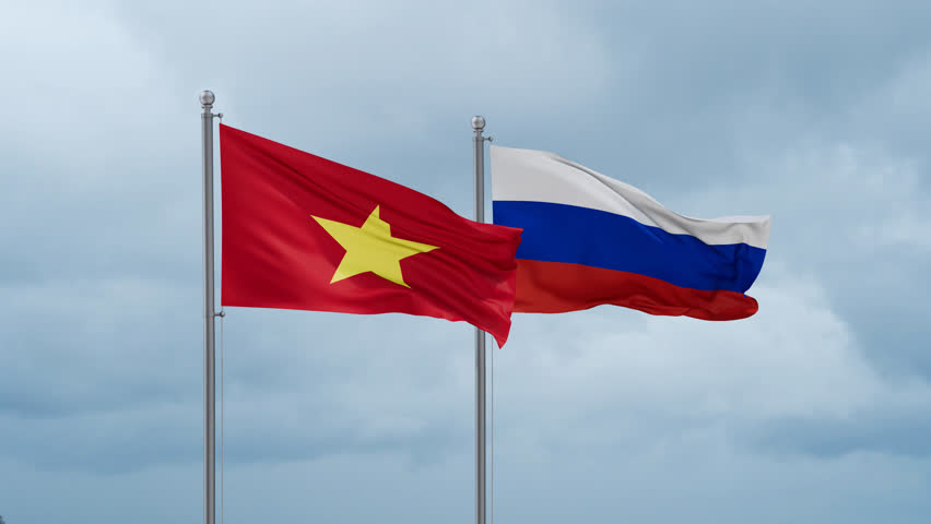Russian Federation and Vietnam flag waving together on cloudy sky, endless seamless loop Royalty-Free Stock Footage #3429402609