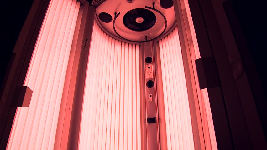 Vertical Solarium Cabin with Pink Lamps is Opened