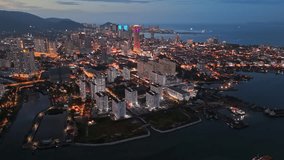 George Town, Penang, Malaysia with city lights. Flying over skyscrapers and avenues after sunset in GeorgeTown, Penang - Powered by Shutterstock - Get 15% off with code: PIKWIZARD15