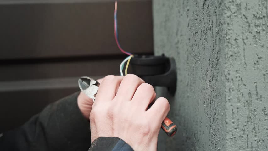Electrician prepares the installation of electrical wiring. Electrician prepares cables for installation Royalty-Free Stock Footage #3429459827