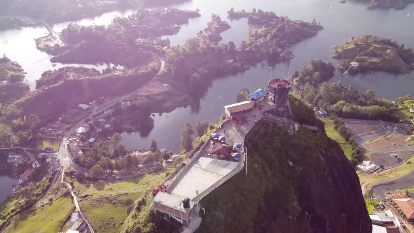 Drone flight over the emblematic Guatape dam, Piedra del Peñol in Medellín, Antioquia Colombia