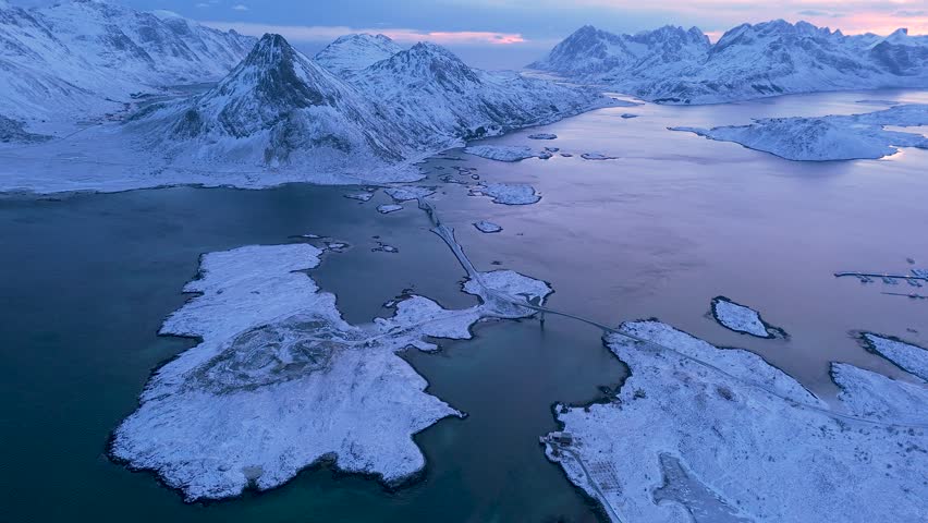 norway lofoten islands aerial shot winter season snowy landscapes sunset colors