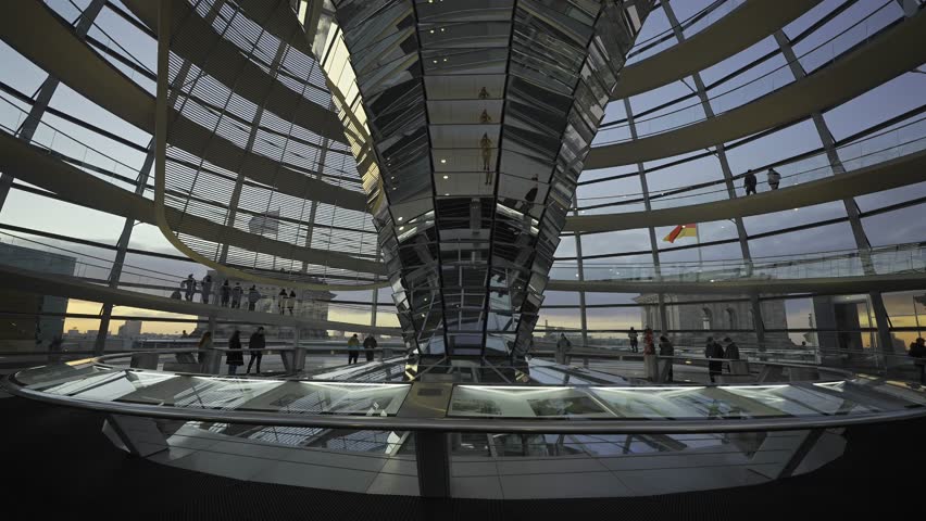 Berlin, Germany. Reichstag glass dome interior at dawn. Spiral walkway inside glass dome of Bundestag in Berlin at sunset. Kuppel und Dachterrasse des Reichstagsgebaudes