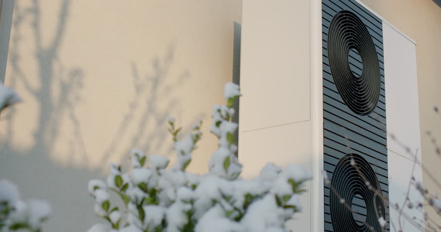 Heat pump near a modern cottage. Modern technologies in heating