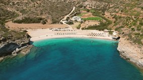 Aerial drone video of iconic turquoise and sapphire bay and beach of Andros, Cyclades, Greece