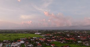 Canggu village countryside with sky at dusk, Bali in Indonesia. Aerial birdseye and copy space