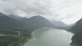Mountain gorizont camera move above the lake -  Aerial footage