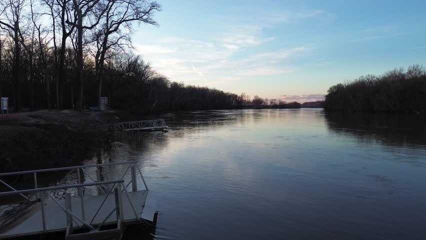 James river shoreline with trees and piers in cold winter morning.