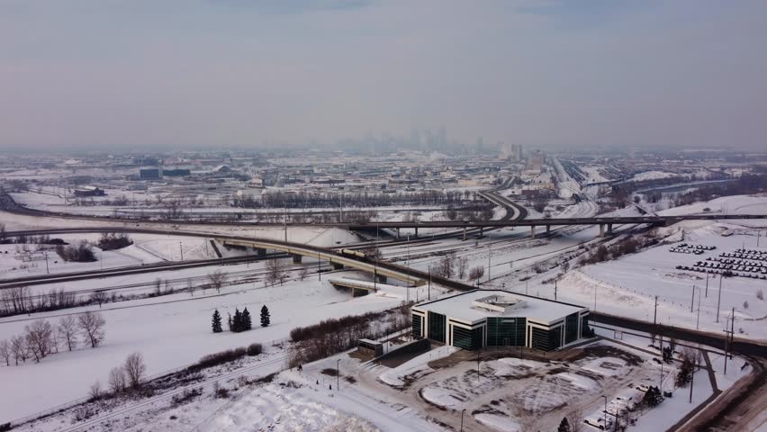 Aerial Winter View of Downtown Calgary Covered in Hazy Clouds.