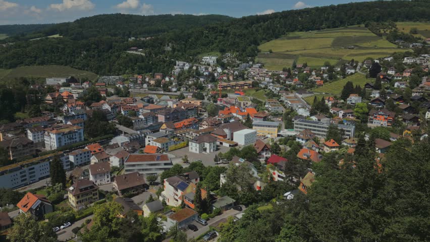 European city. Streets. Buildings. Roads. Transportation system. Old houses. Summer. Switzerland. Roads. The car goes on the road. Aerial survey. Apartment buildings. Bedroom neighborhood. Family