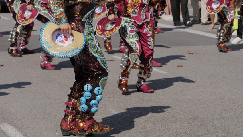 BARCELONA, SPAIN, 12 OCTOBER 2023. Passage de gracia parade day of spain. The Gracia local street festival. Parade of people dancing in traditional costumes. Peru traditional dance