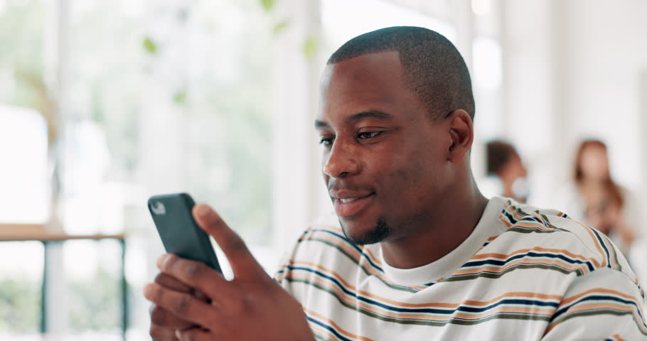 Cafe, phone and happy black man reading on social media, network or funny meme online. Smartphone, smile and African person in restaurant, scroll on mobile app and communication on digital technology