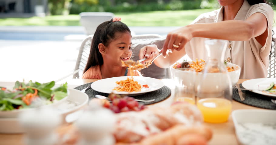 Happy, pasta and child with mother at lunch for family bonding, food and health. Nutrition, relax and hungry with people eating in dining room at home for love, care and holiday event together