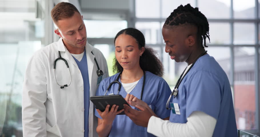 Healthcare, tablet and doctor with medical team in hospital for training, diagnosis or internship. Nurses, technology and research with professional medicine group in clinic for health discussion