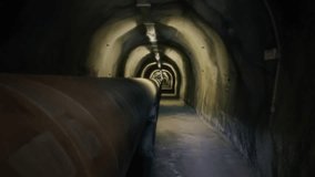 Underground Pipe Structure Corridor Walking Through Tunnel Tracking Shot. Walking through a long underground corridor with a drainage pipe structure. Tracking shot - Powered by Shutterstock - Get 15% off with code: PIKWIZARD15