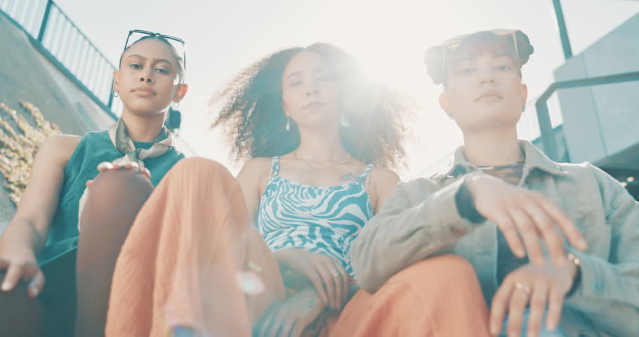 Fashion, friends and face of women on stairs in trendy clothes, casual outfit and modern style in city. Attitude, confident and portrait of people in urban town for holiday, weekend and vacation