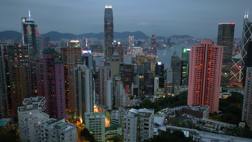 Hong Kong timelapse at night, Chinese megapolis night time lapse, illuminated skyscrapers of Hong Kong at night. High quality 4k footage