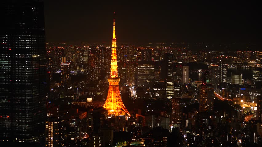 Aerial View of Japanese skycrapers from Roppongi, Tokyo, Japan at night. Scenery of central downtown area with Tokyo Tower and business district. High quality 4k footage Royalty-Free Stock Footage #3430027245